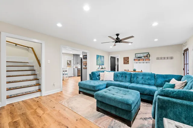 a bedroom with a bed and painting on the wall