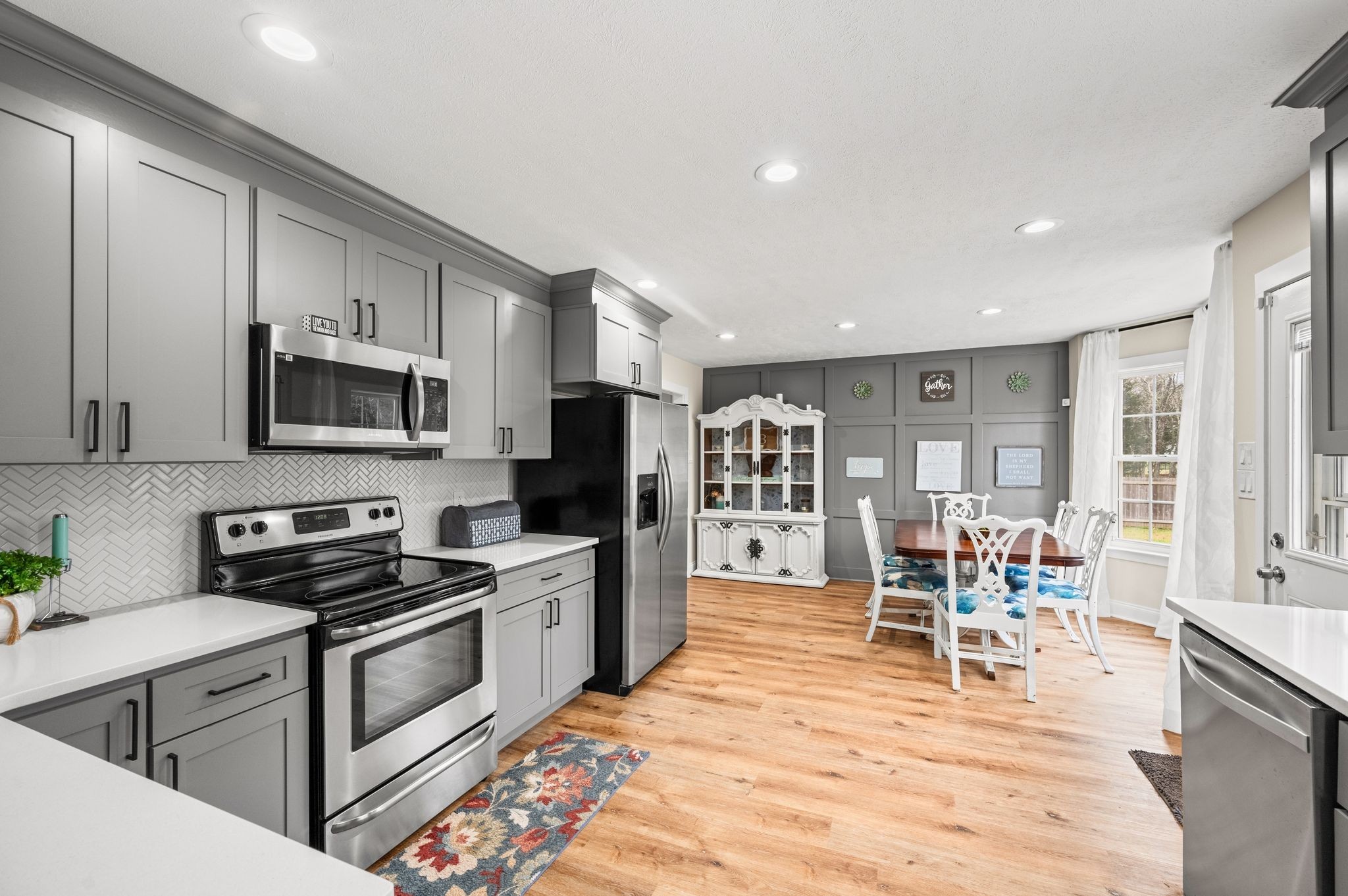 1993 Egypt Road Chapel Hill, TN 37034 - Photo 35 of 79 a kitchen with stainless steel appliances kitchen island granite countertop a stove top oven a sink a dining table and chairs with wooden floor