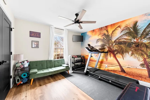 a spacious bathroom with a sink and a mirror