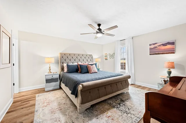 a view of walk in closet with clothes
