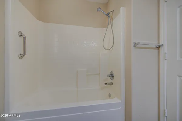 a bathroom with a toilet a sink and a window