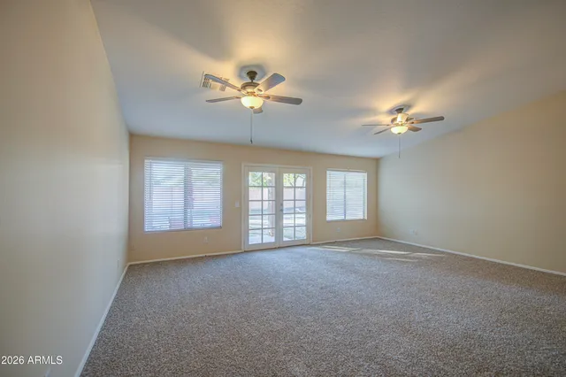 a kitchen with stainless steel appliances granite countertop a sink refrigerator and cabinets