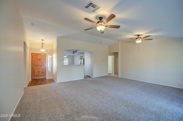 a view of an empty room with a window