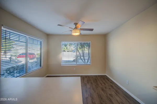a kitchen with stainless steel appliances granite countertop a sink refrigerator and cabinets