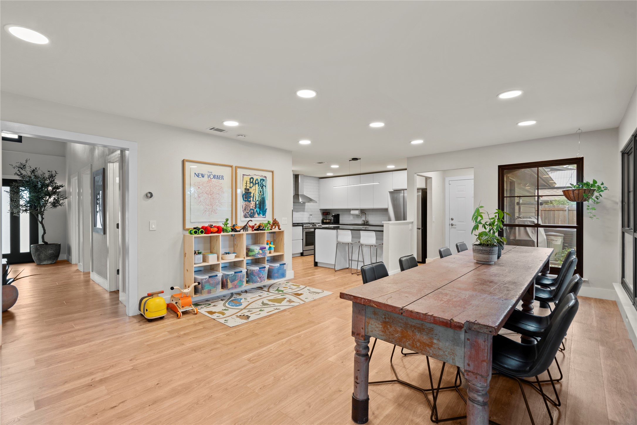 7107 Greenock Street Austin, TX 78749 - Photo 11 of 40 This open-concept living space features hardwood floors, recessed lighting, and large windows