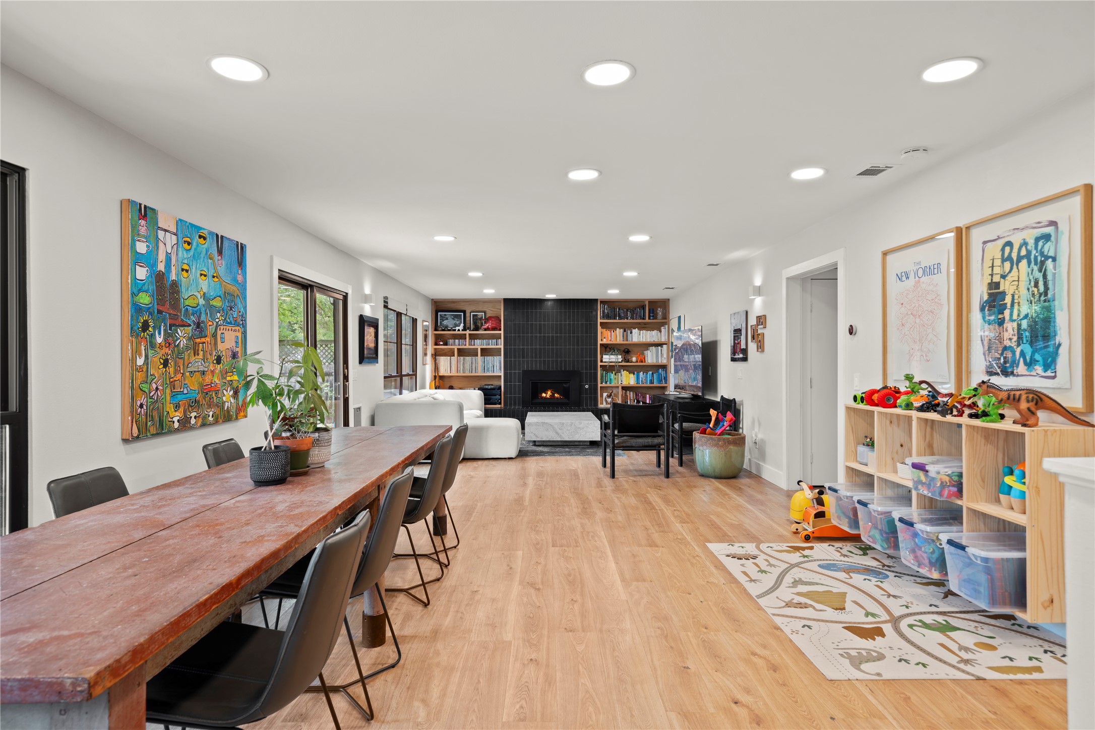 7107 Greenock Street Austin, TX 78749 - Photo 12 of 40 This expansive open-concept room features light-toned hardwood flooring and recessed lighting throughout