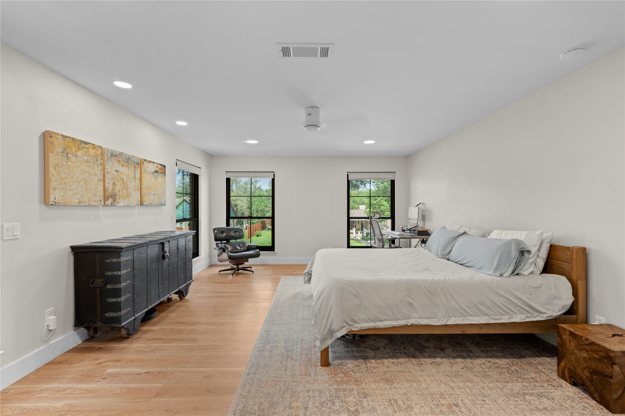 7107 Greenock Street Austin, TX 78749 - Photo 21 of 40 This room features light hardwood flooring, recessed lighting, and two windows providing natural light