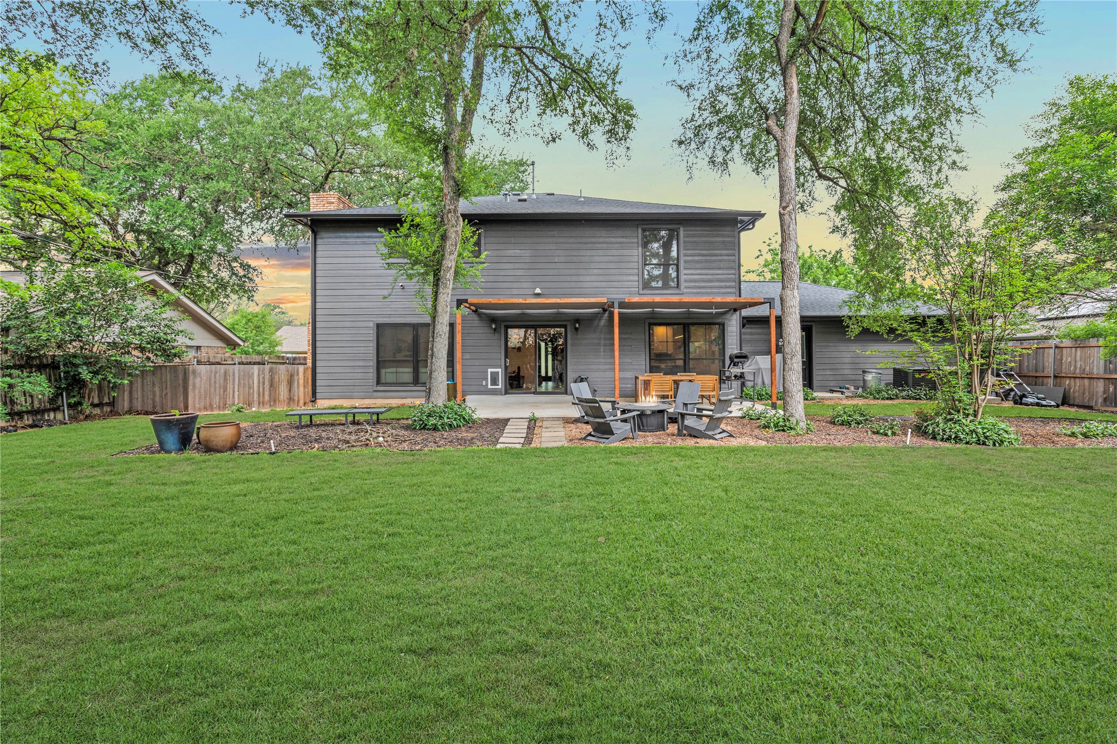 7107 Greenock Street Austin, TX 78749 - Photo 39 of 40 The property features an extensive yard with a well-maintained lawn and mature trees