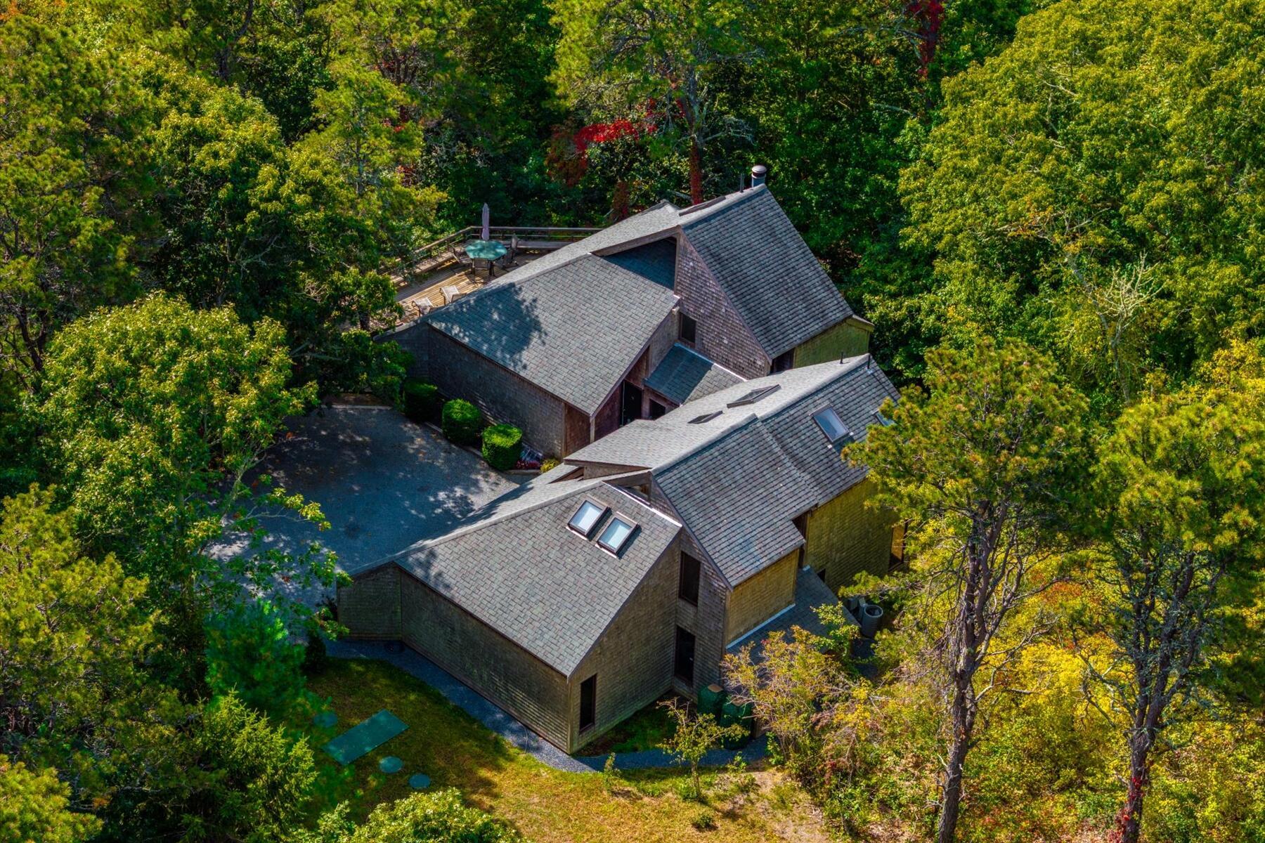 256 Browns Neck Road Wellfleet, MA 02667 - Photo 3 of 66 a view of a small house with a tree in the background