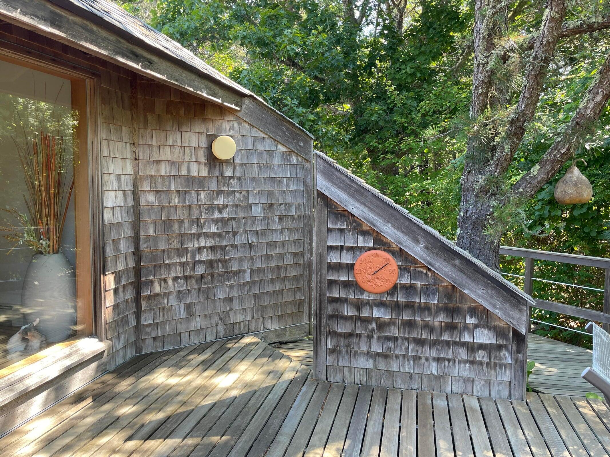 256 Browns Neck Road Wellfleet, MA 02667 - Photo 50 of 66 a backyard of a house with seating space
