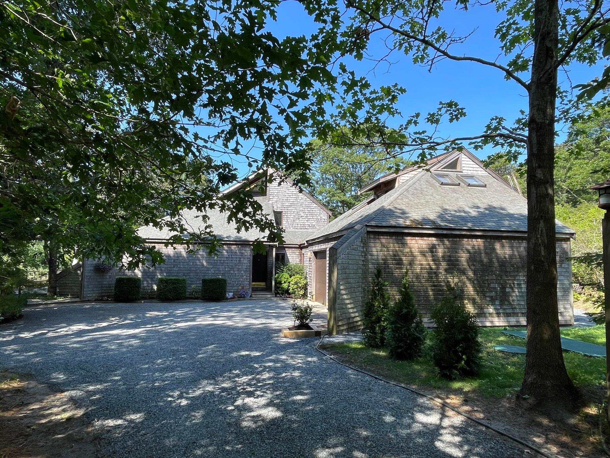 256 Browns Neck Road Wellfleet, MA 02667 - Photo 60 of 66 a view of a car park in front of a house