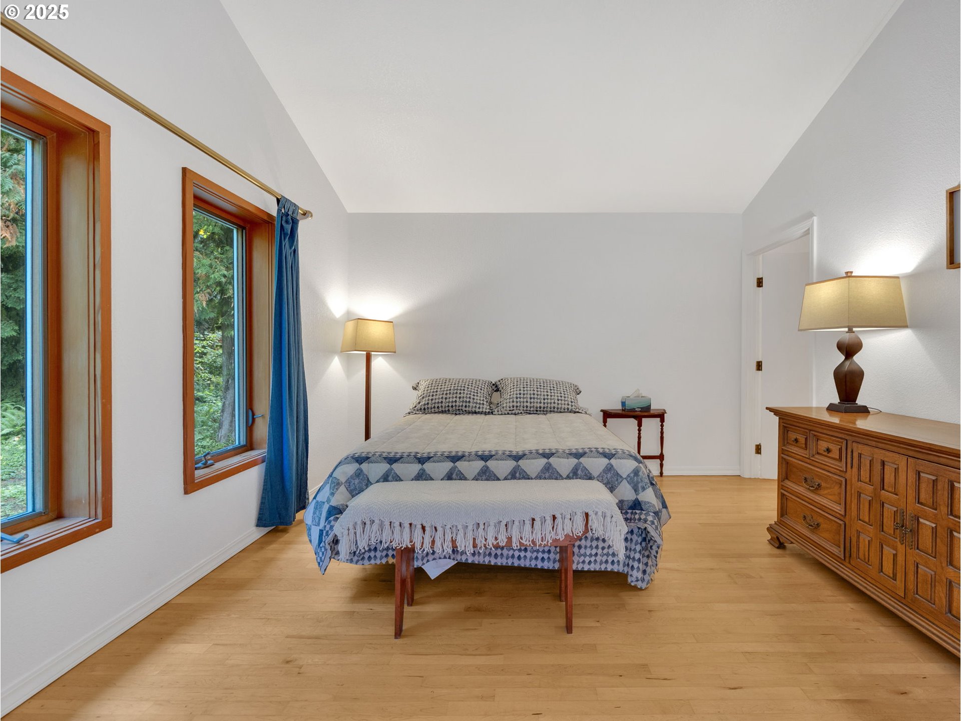 64079 East Barlow Trail Road Rhododendron, OR 97049 - Photo 20 of 48 a bedroom with a large bed and a window
