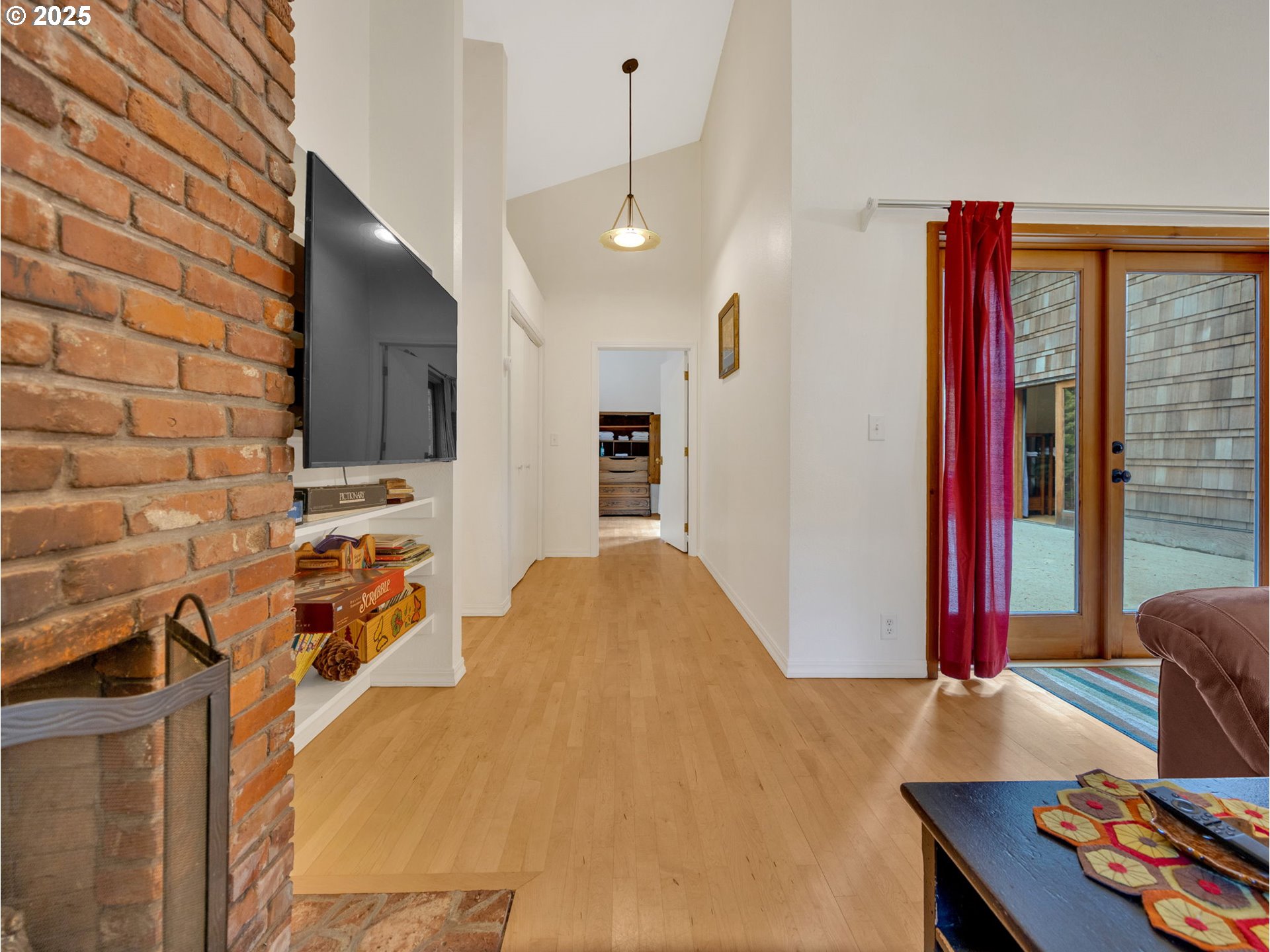64079 East Barlow Trail Road Rhododendron, OR 97049 - Photo 24 of 48 a bedroom with a bed and a flat screen tv
