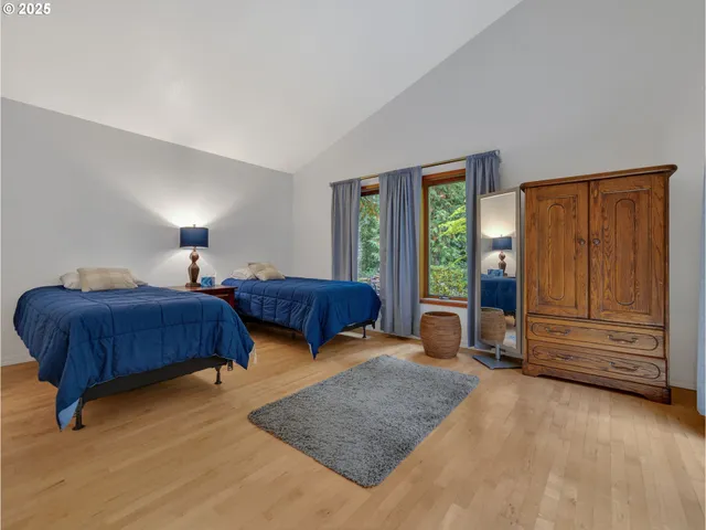 a bedroom with a bed and window