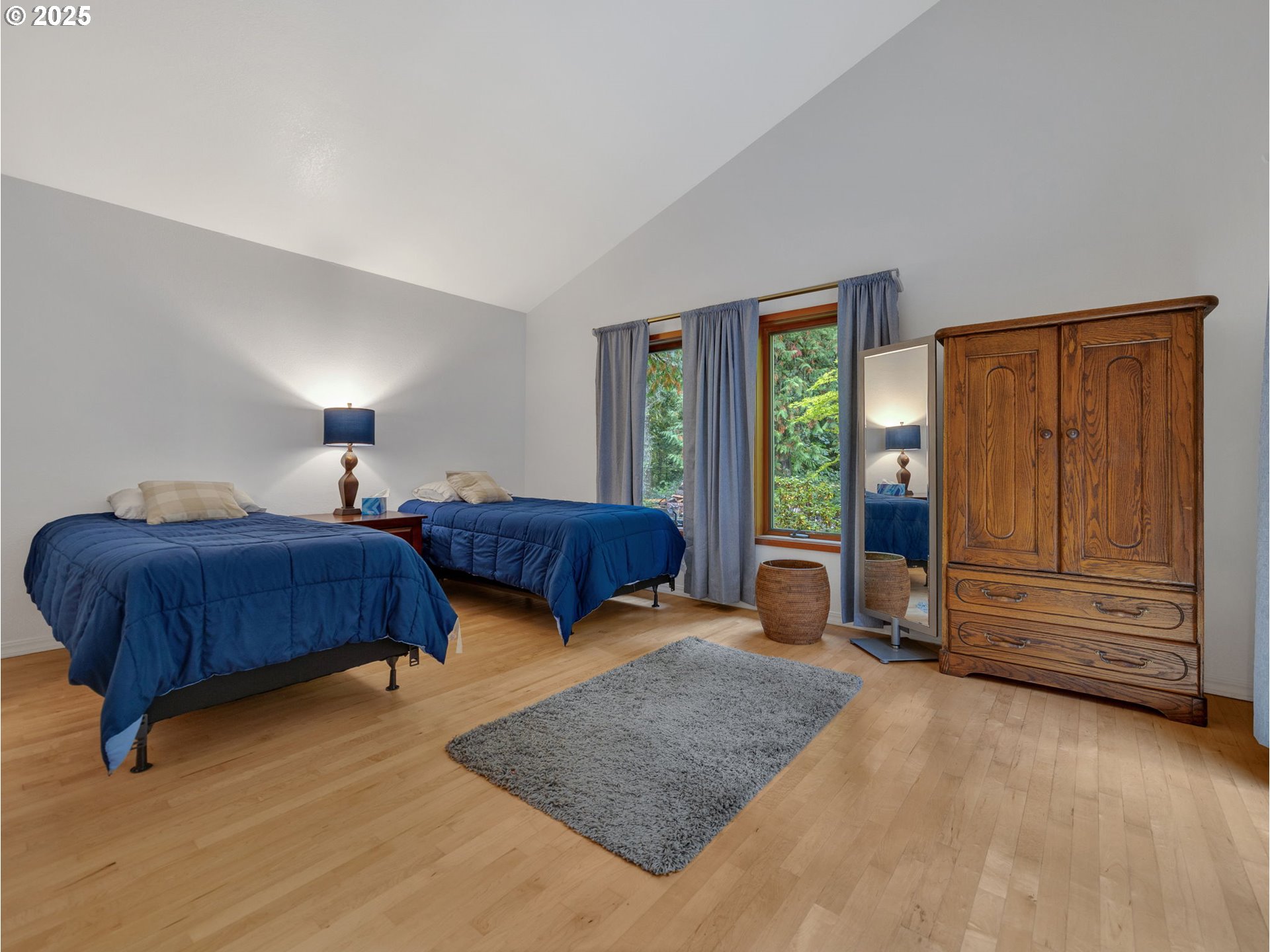 64079 East Barlow Trail Road Rhododendron, OR 97049 - Photo 25 of 48 a bedroom with a bed and window