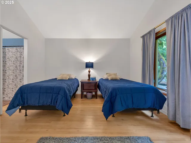 a bedroom with a bed and a dresser next to it