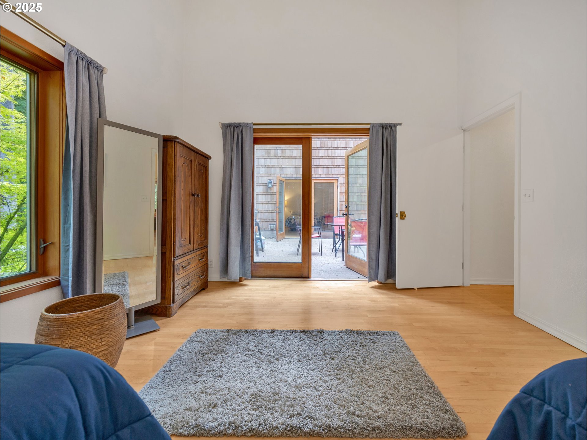 64079 East Barlow Trail Road Rhododendron, OR 97049 - Photo 27 of 48 a view of a bedroom with furniture and a window