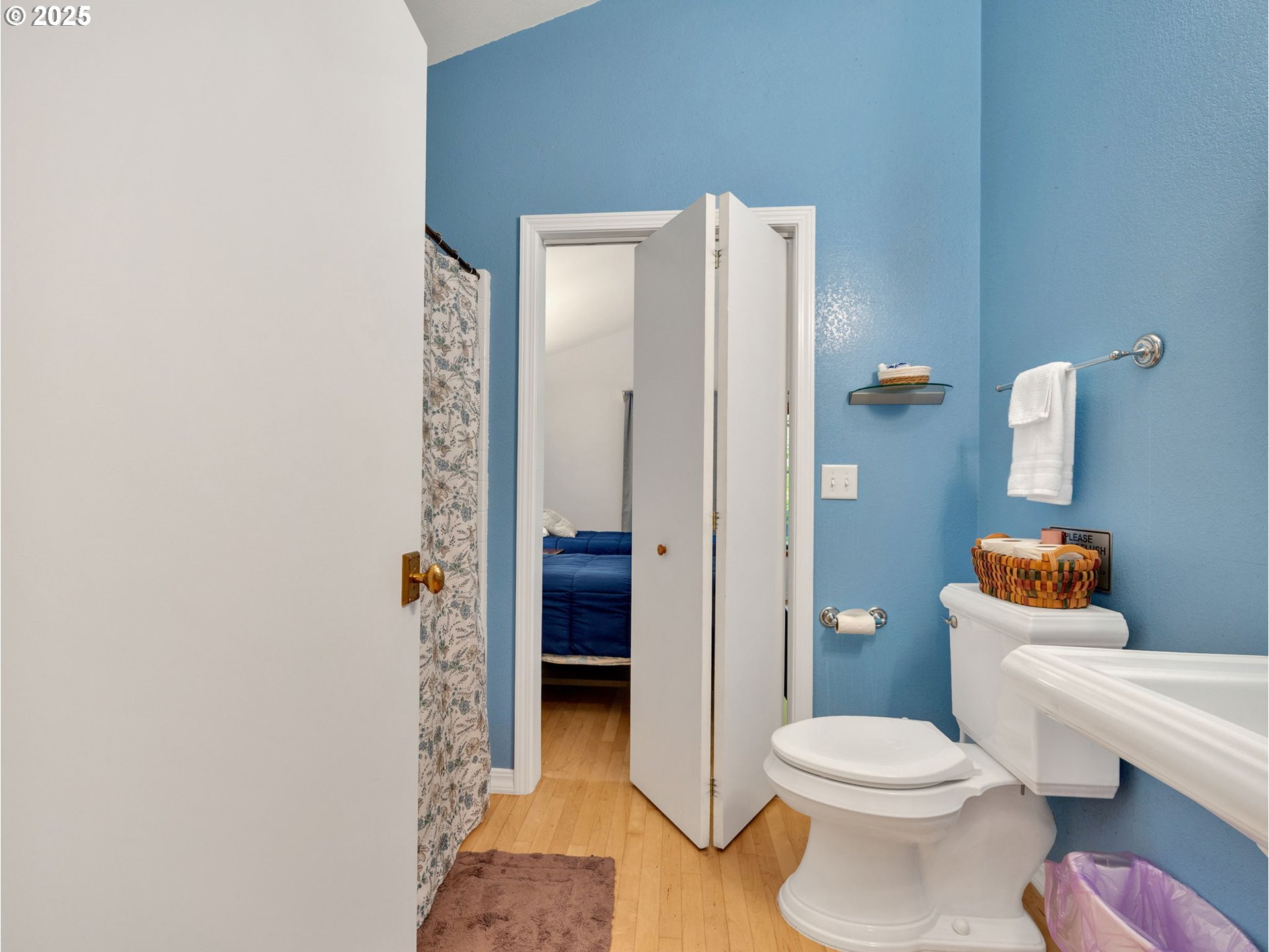 64079 East Barlow Trail Road Rhododendron, OR 97049 - Photo 28 of 48 a white toilet sitting next to a bathroom sink and a shower