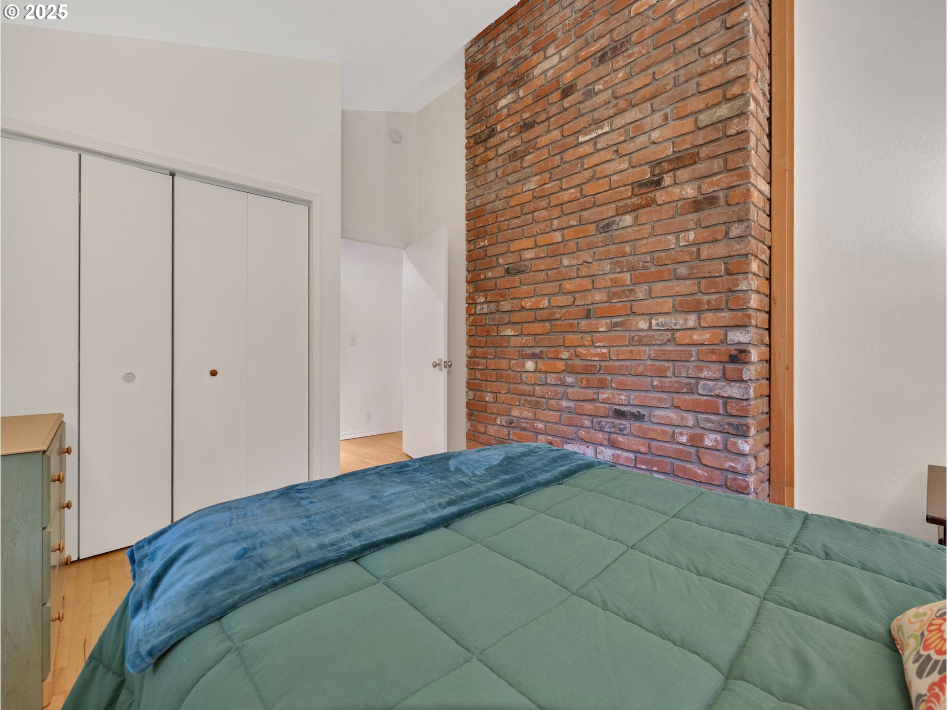 64079 East Barlow Trail Road Rhododendron, OR 97049 - Photo 33 of 48 a bedroom with a bed and a plant