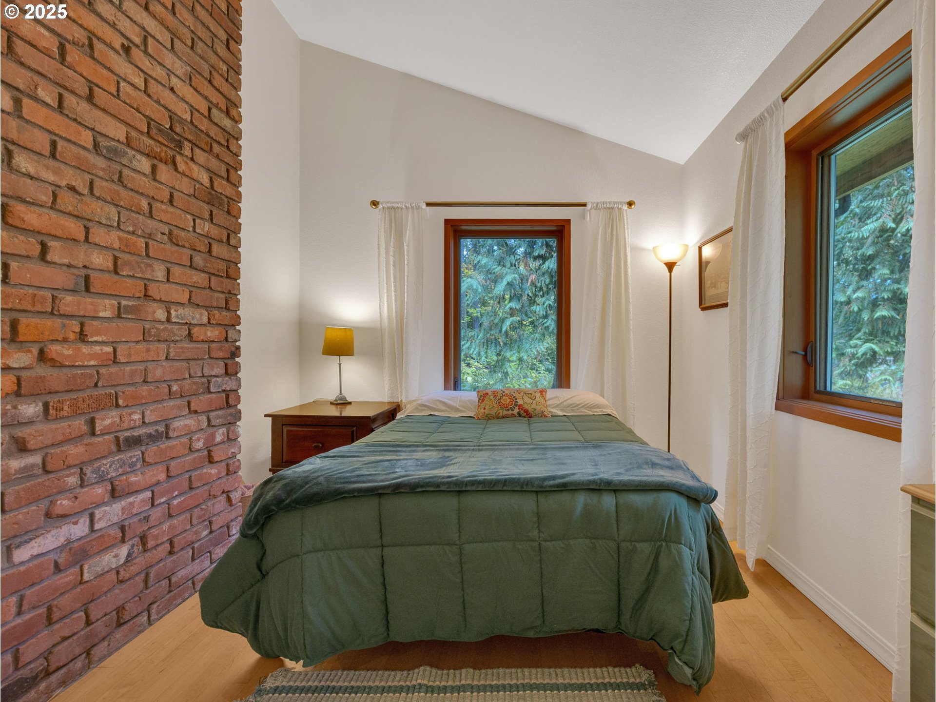 64079 East Barlow Trail Road Rhododendron, OR 97049 - Photo 34 of 48 a bedroom with a bed and a window