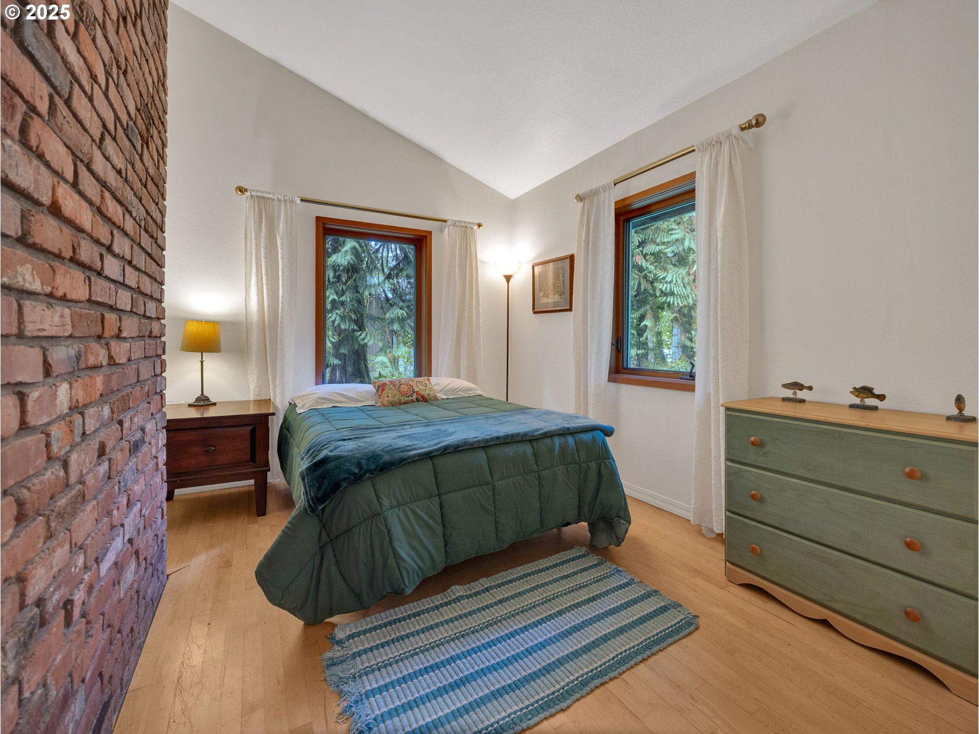 64079 East Barlow Trail Road Rhododendron, OR 97049 - Photo 35 of 48 a bedroom with a bed window and a dresser