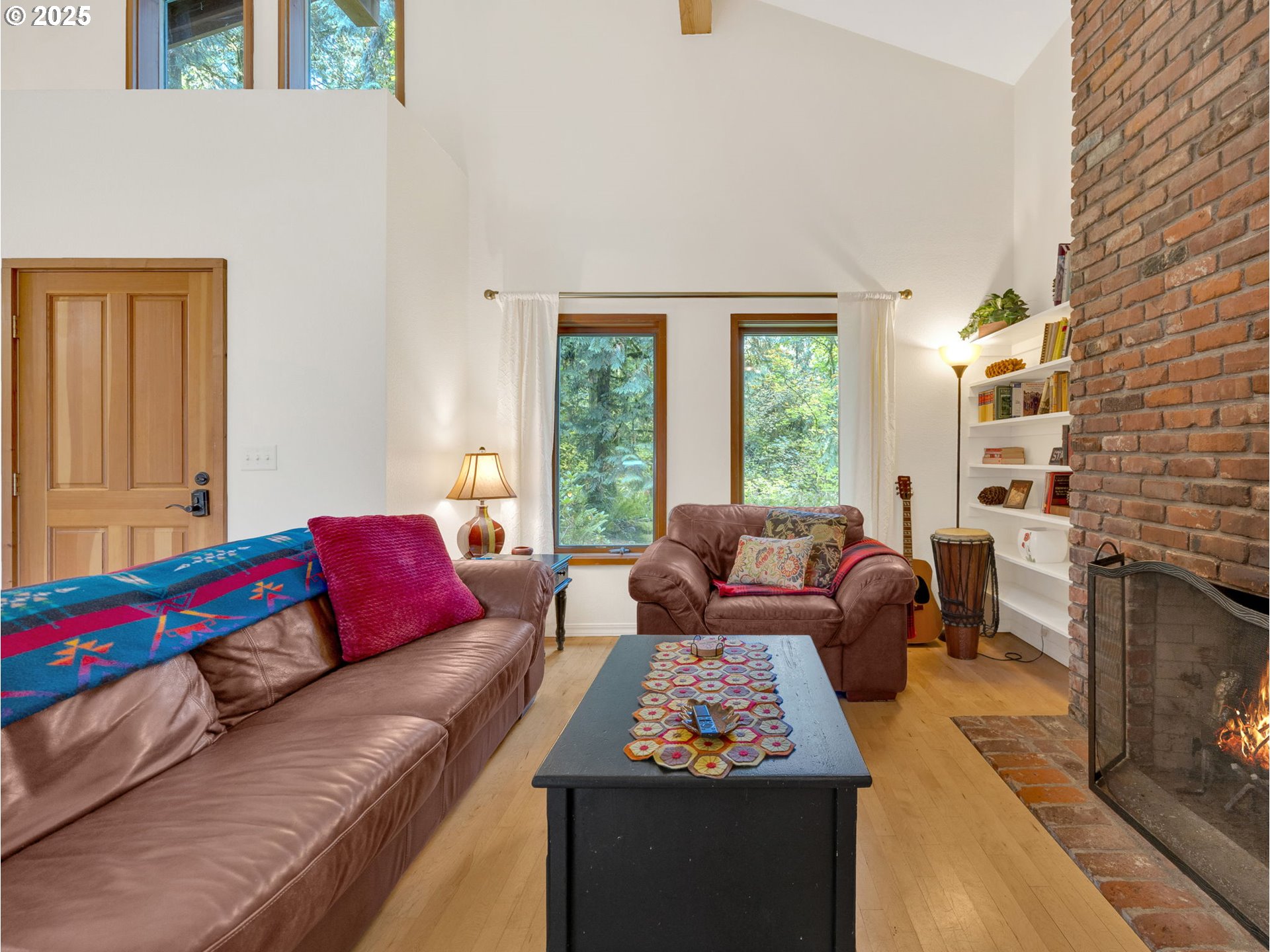 64079 East Barlow Trail Road Rhododendron, OR 97049 - Photo 6 of 48 a living room with furniture fireplace and a window