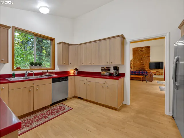 a kitchen with sink cabinets and window