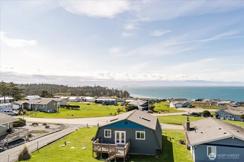 an aerial view of a house with a swimming pool