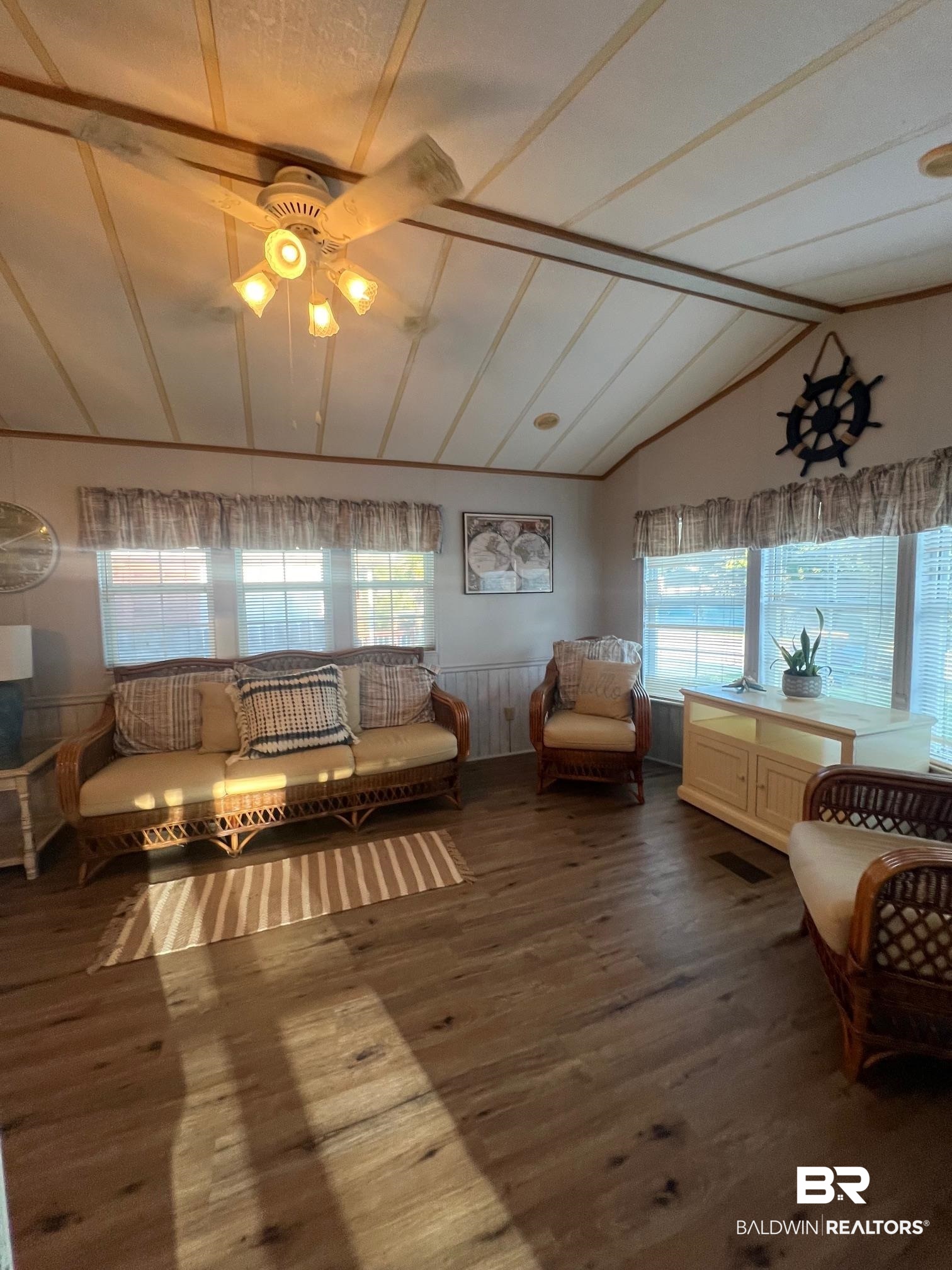 698 Escambia Loop Lillian, AL 36549 - Photo 3 of 16 Living room with wood-type flooring, lofted ceiling, and ceiling fan