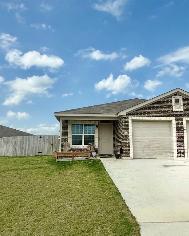 301 Dolphin Drive, Unit A Temple, TX 76501 - Photo 1 of 1 a front view of a house with a garden and plants