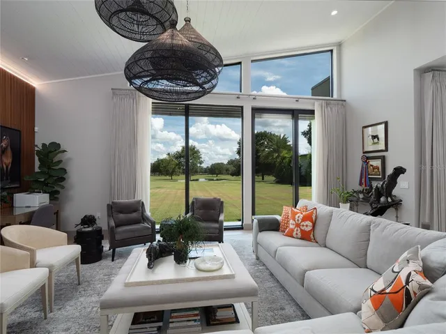 a kitchen with granite countertop white cabinets and white stainless steel appliances