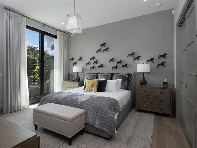 a front view of a house with swimming pool having outdoor seating