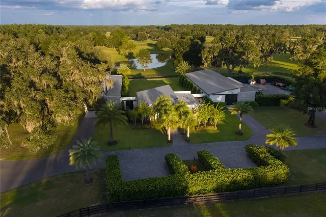 a view of a swimming pool with a yard