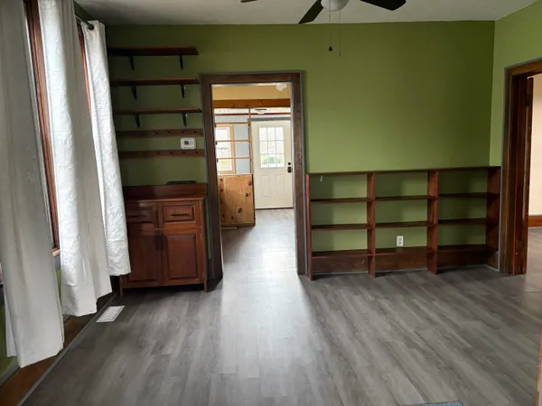 a room with wooden floors and closet