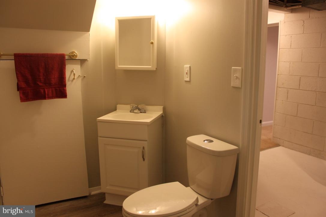 1654 Riverwood Road Baltimore, MD 21221 - Photo 22 of 30 a bathroom with a toilet and a sink