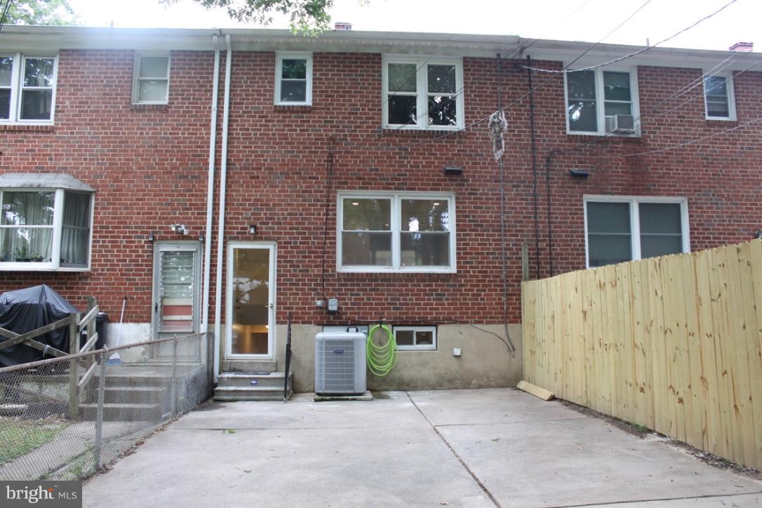 1654 Riverwood Road Baltimore, MD 21221 - Photo 25 of 30 a view of a brick house with many windows