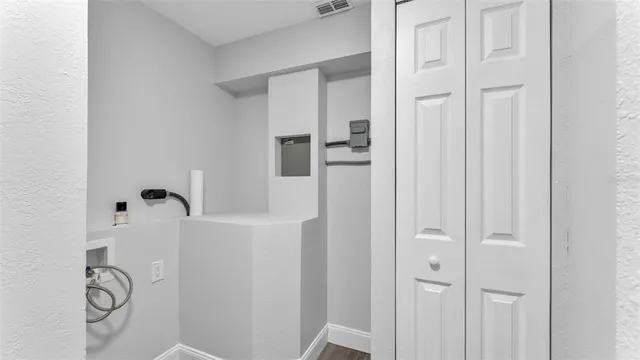 a view of a bathroom with wooden floor