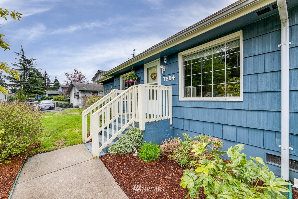 7404 Lower Ridge Road Everett, WA 98203 - Photo 31 of 33 a front view of a house with a yard