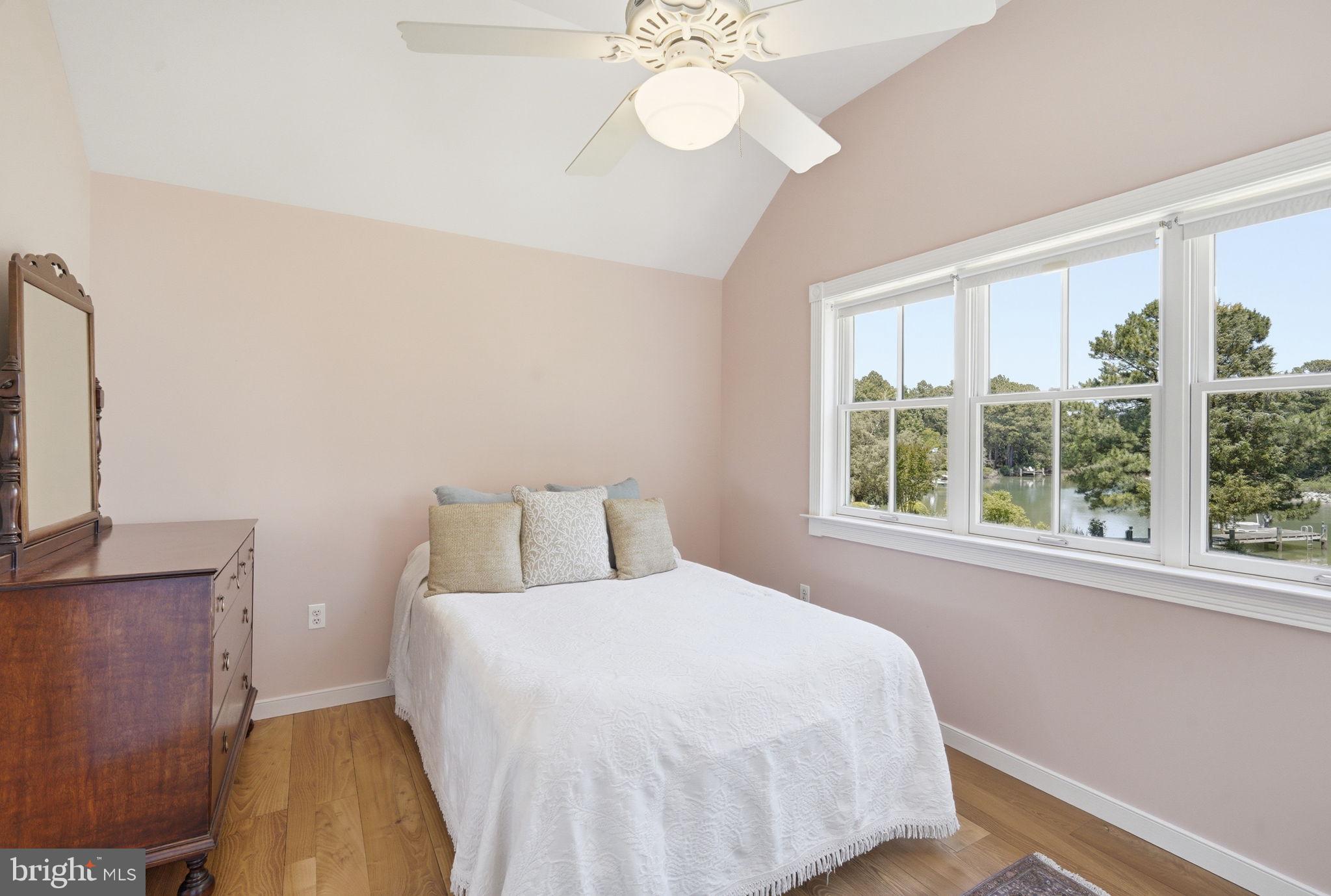 26226 Langs Landing Road Oxford, MD 21654 - Photo 31 of 48 a bedroom with a bed and a window