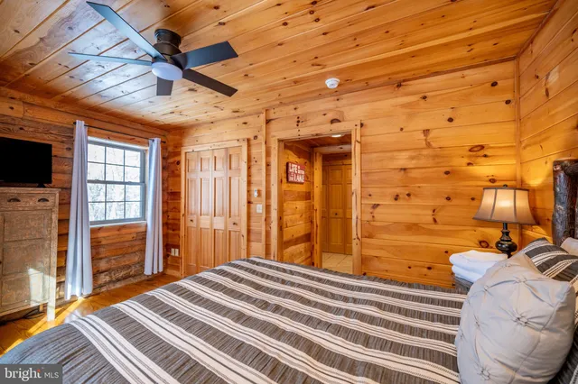 a living room with furniture a fireplace with wooden floor