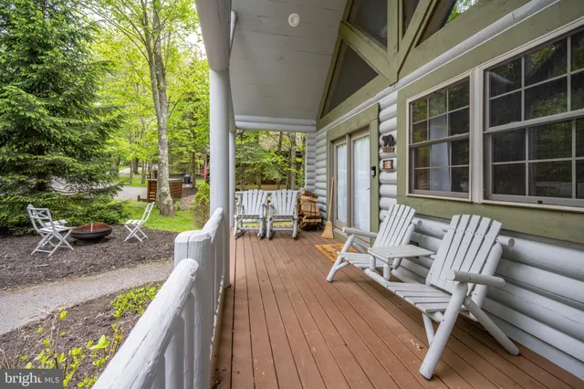 a balcony with wooden floor and furniture