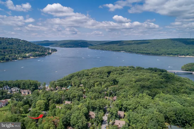 a kitchen with stainless steel appliances granite countertop a stove and a wooden cabinets
