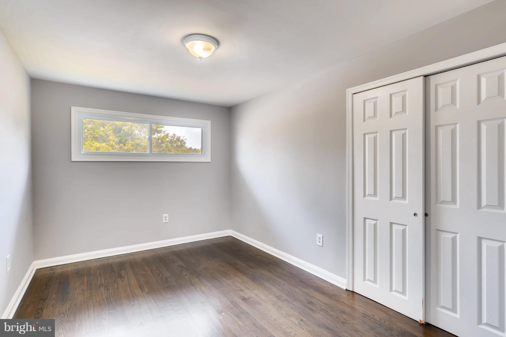 4103 Ronis Road Baltimore, MD 21208 - Photo 11 of 22 an empty room with wooden floor and closet