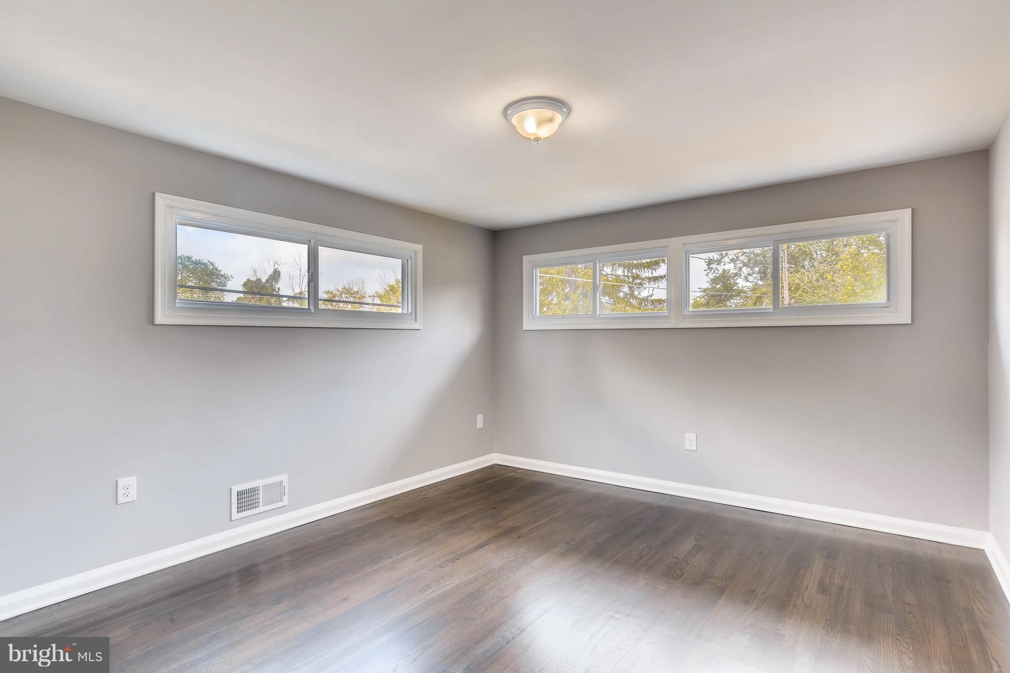 4103 Ronis Road Baltimore, MD 21208 - Photo 12 of 22 a view of a room with wooden floor and window