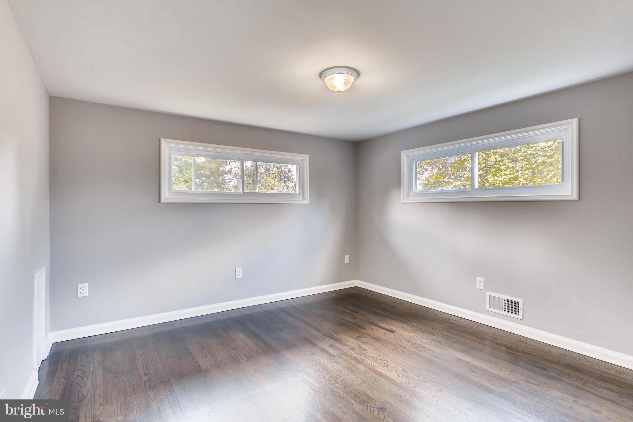 4103 Ronis Road Baltimore, MD 21208 - Photo 13 of 22 wooden floor in an empty room with a window