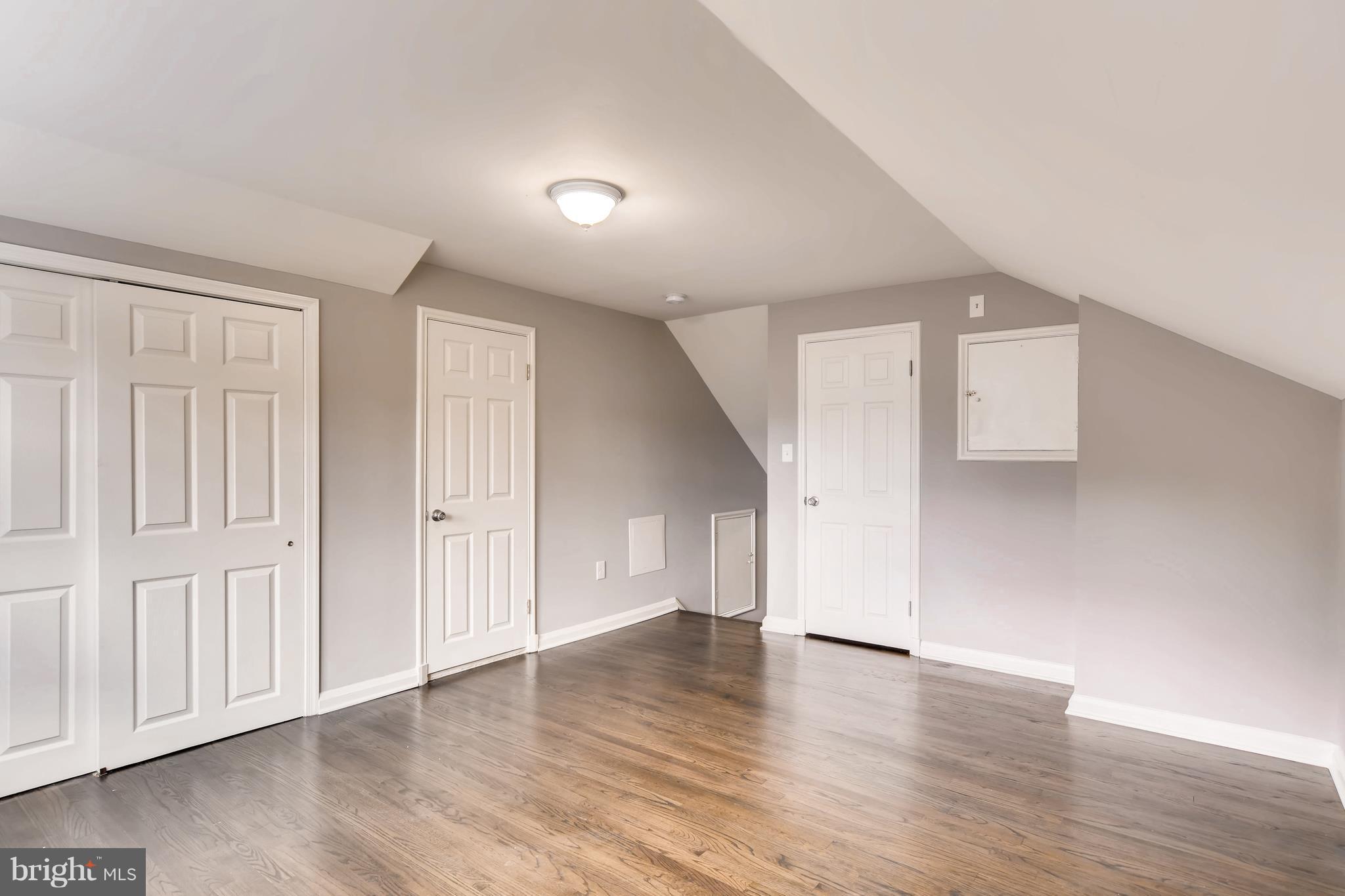 4103 Ronis Road Baltimore, MD 21208 - Photo 16 of 22 a view of empty room with wooden floor and entryway