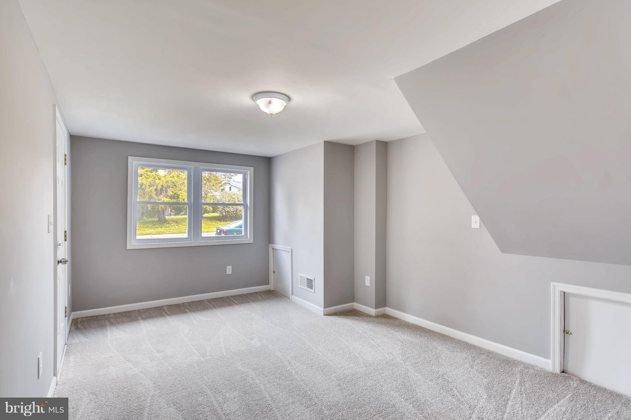 4103 Ronis Road Baltimore, MD 21208 - Photo 18 of 22 a view of an empty room with a window