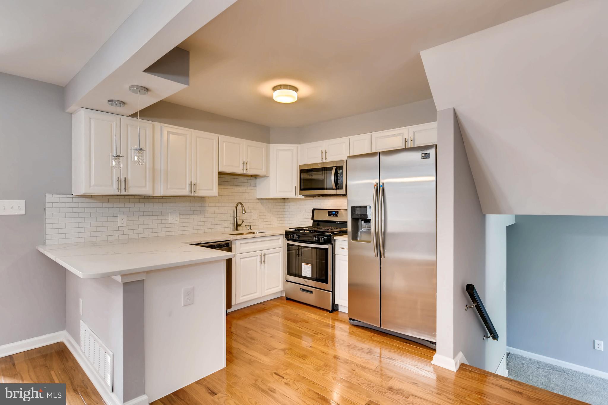 4103 Ronis Road Baltimore, MD 21208 - Photo 8 of 22 a kitchen with stainless steel appliances granite countertop a refrigerator a stove and a sink