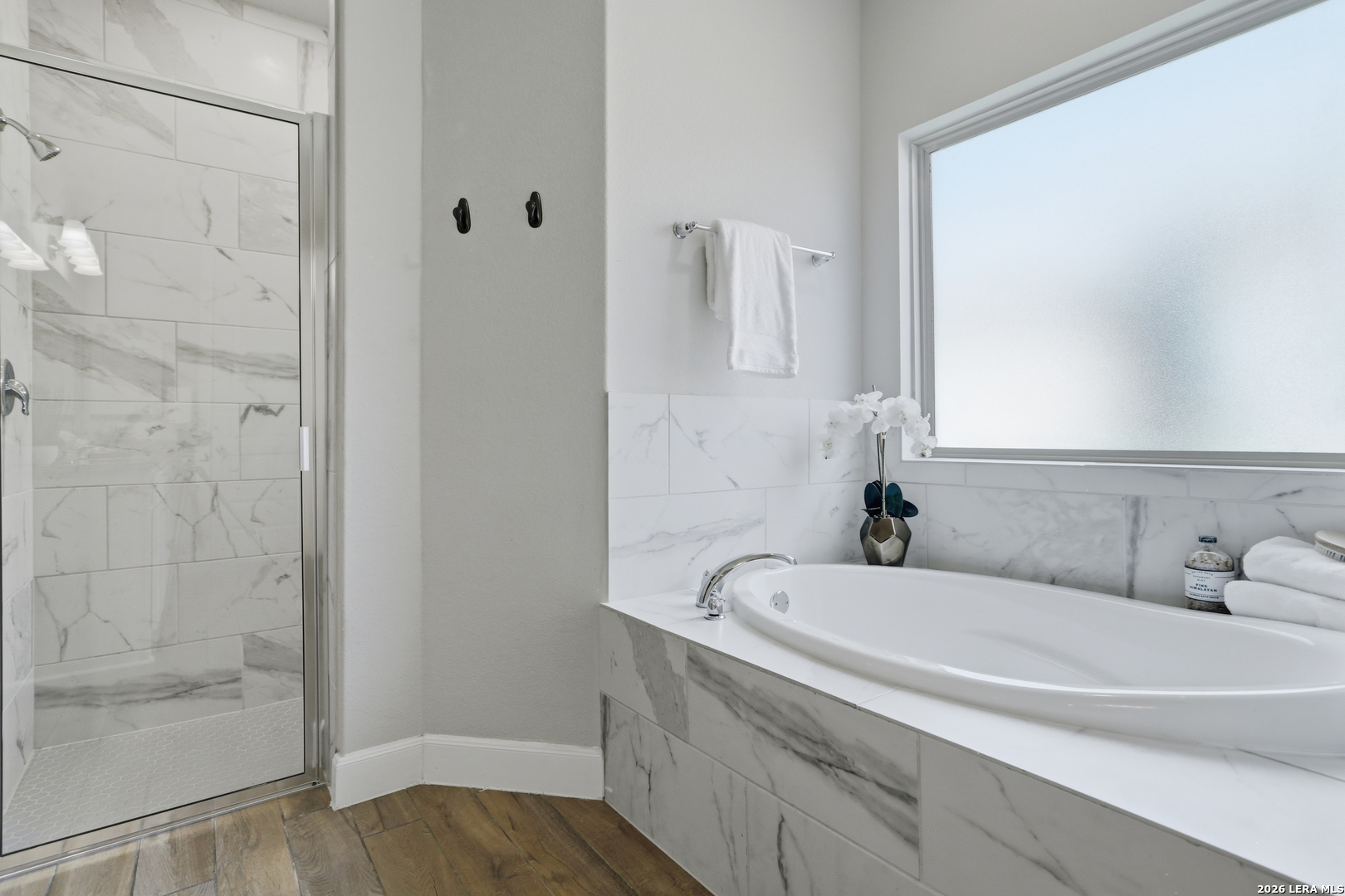 337 Misty Sails Cibolo, TX 78108 - Photo 23 of 50 a bathroom with a tub and a shower