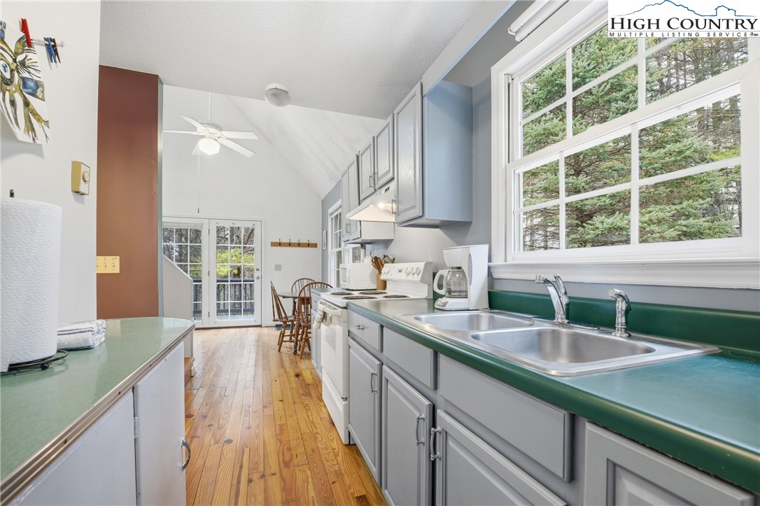 476 Moon Ridge Road Crumpler, NC 28617 - Photo 5 of 35 a kitchen with a sink stove and a large window
